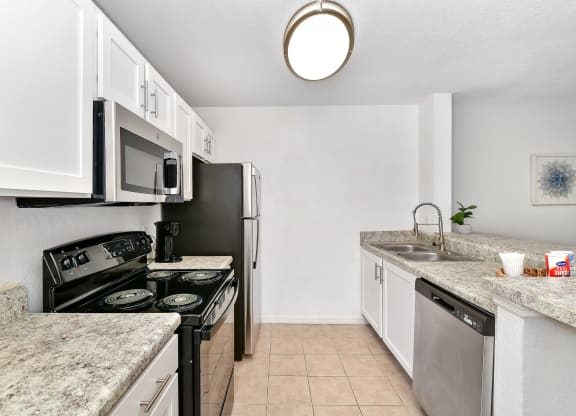 kitchen with white cabinets at Village Lakes, Orlando